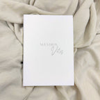 Libro de votos Novellie con diseño elegante y detalles decorativos en la portada.